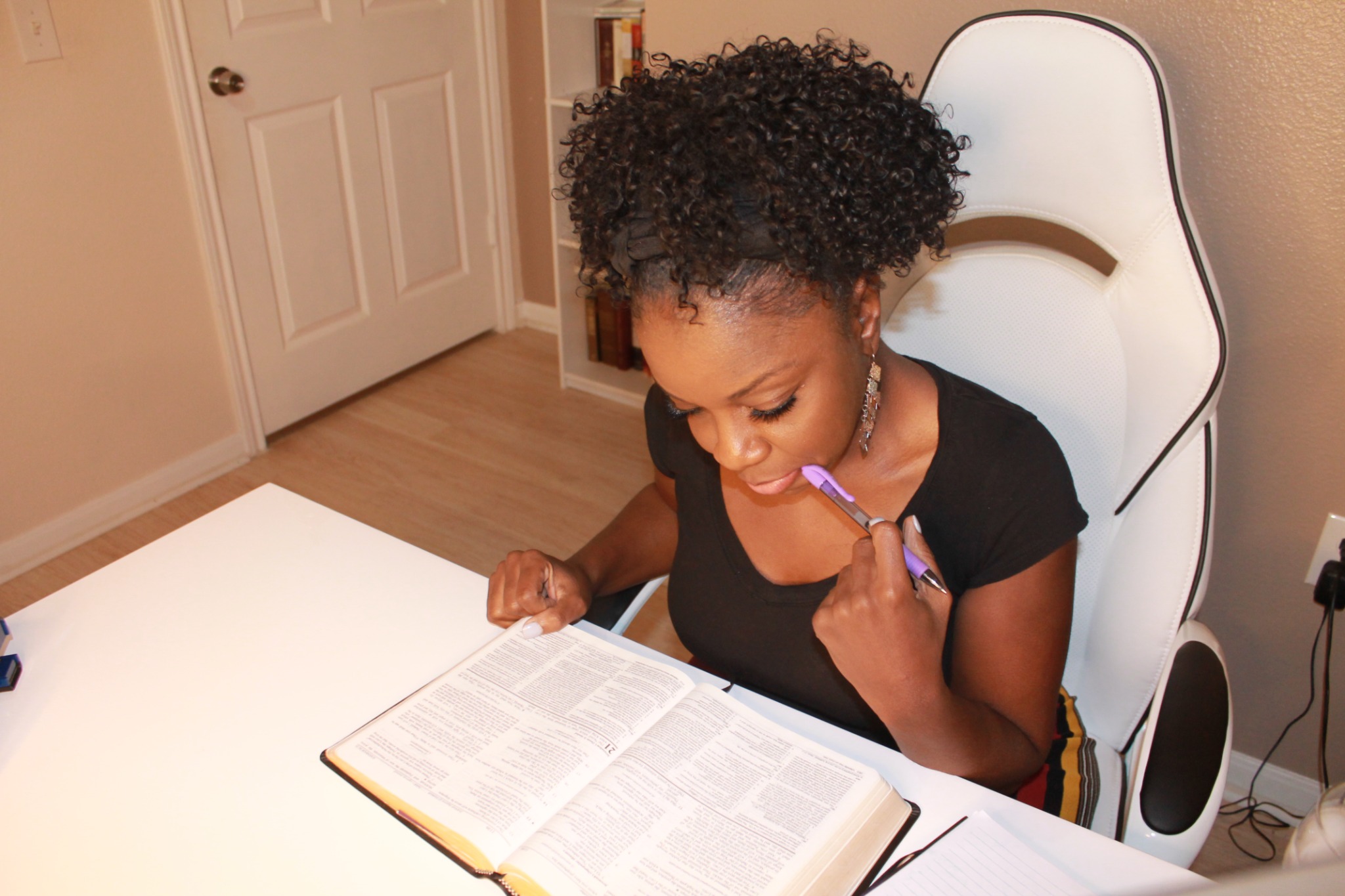 Mandy reflecting while reading the Bible